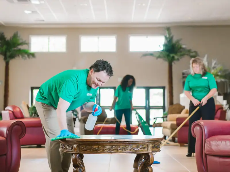 Office Pride employee cleaning a lobby