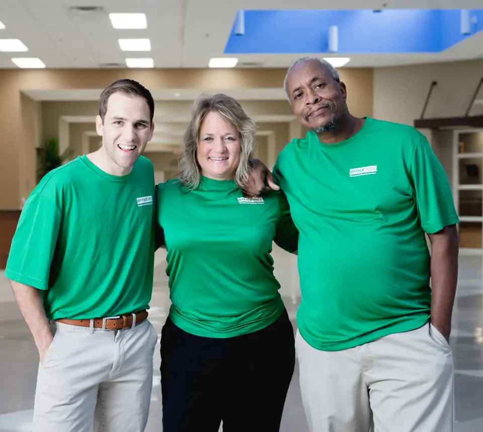Three Office Pride employees wearing branded polos